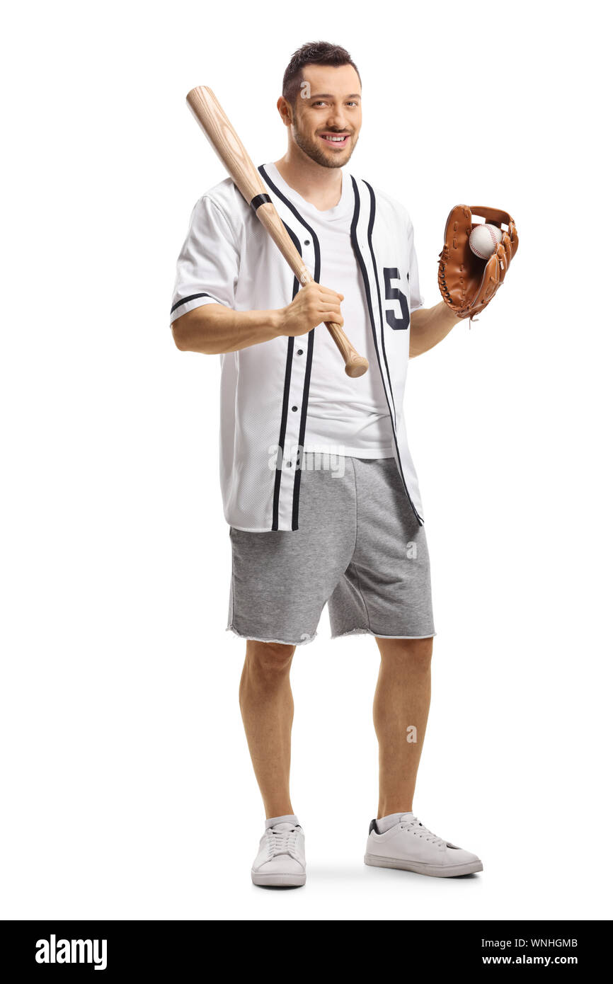 In voller Länge Porträt ein Kerl mit einem Baseballschläger und eine Kugel in einen Handschuh an der Kamera auf weißem Hintergrund lächelnd Stockfoto