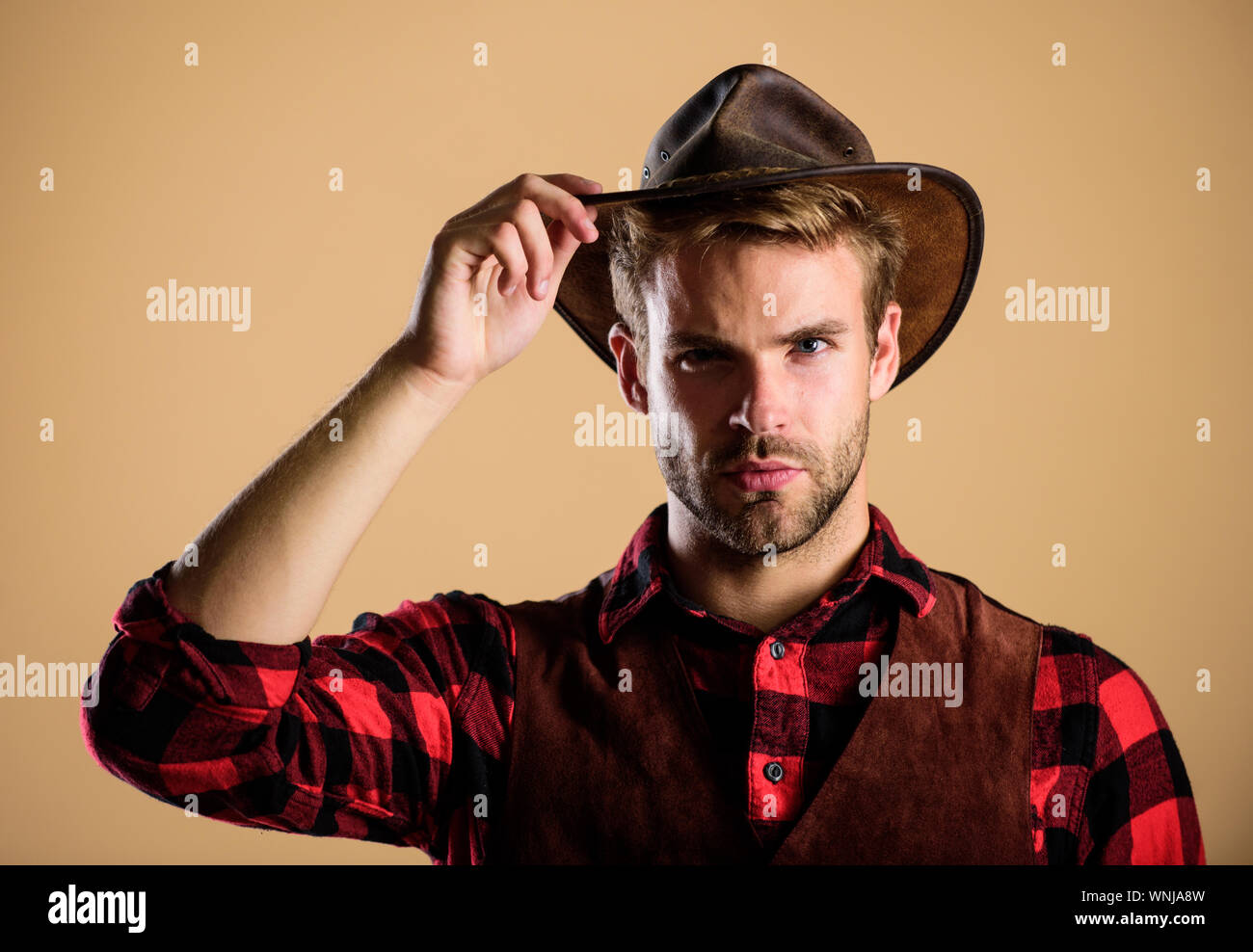 Cowboy Hut tragen. American Cowboy. Schönheit Standard. Beispiel wahrer Männlichkeit. Westliche