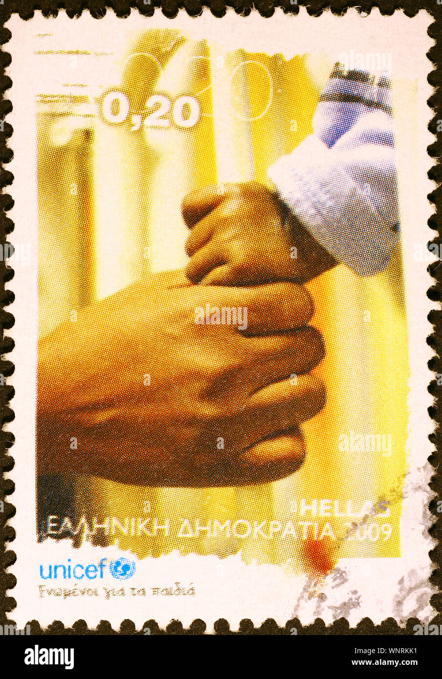 Griechische Stempel für Unicef mit einer Hand des Kindes Stockfoto