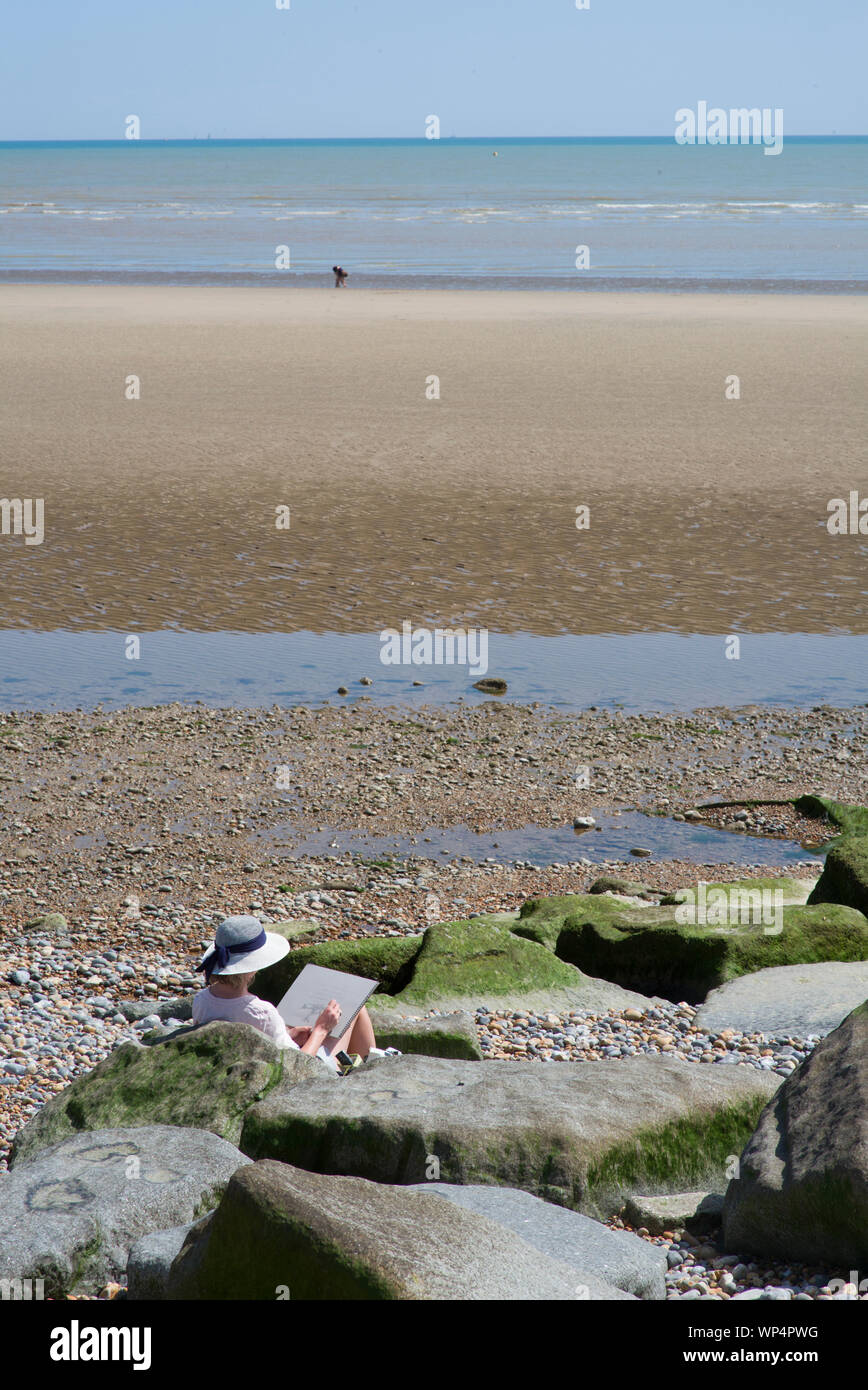 Künstler Malerei am Strand Stockfoto