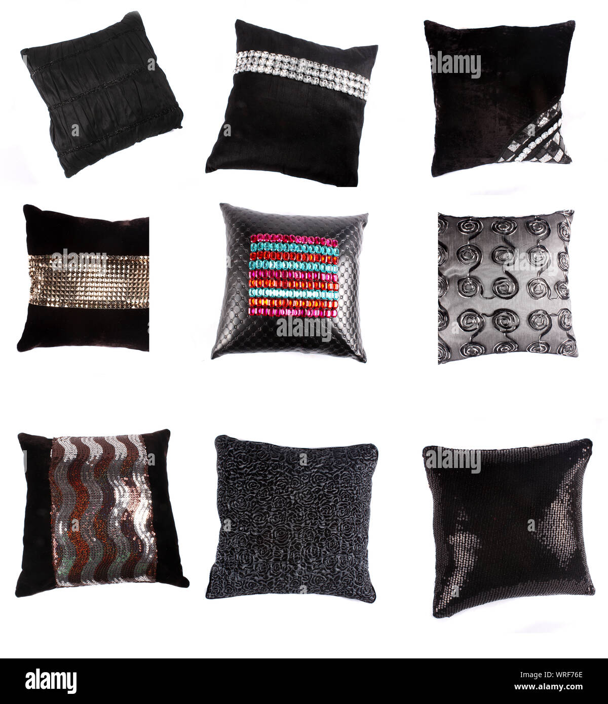 Eine Reihe von luxuriösen Kissen und Polster mit schönen Designs, auf weissem Studiohintergrund. Stockfoto