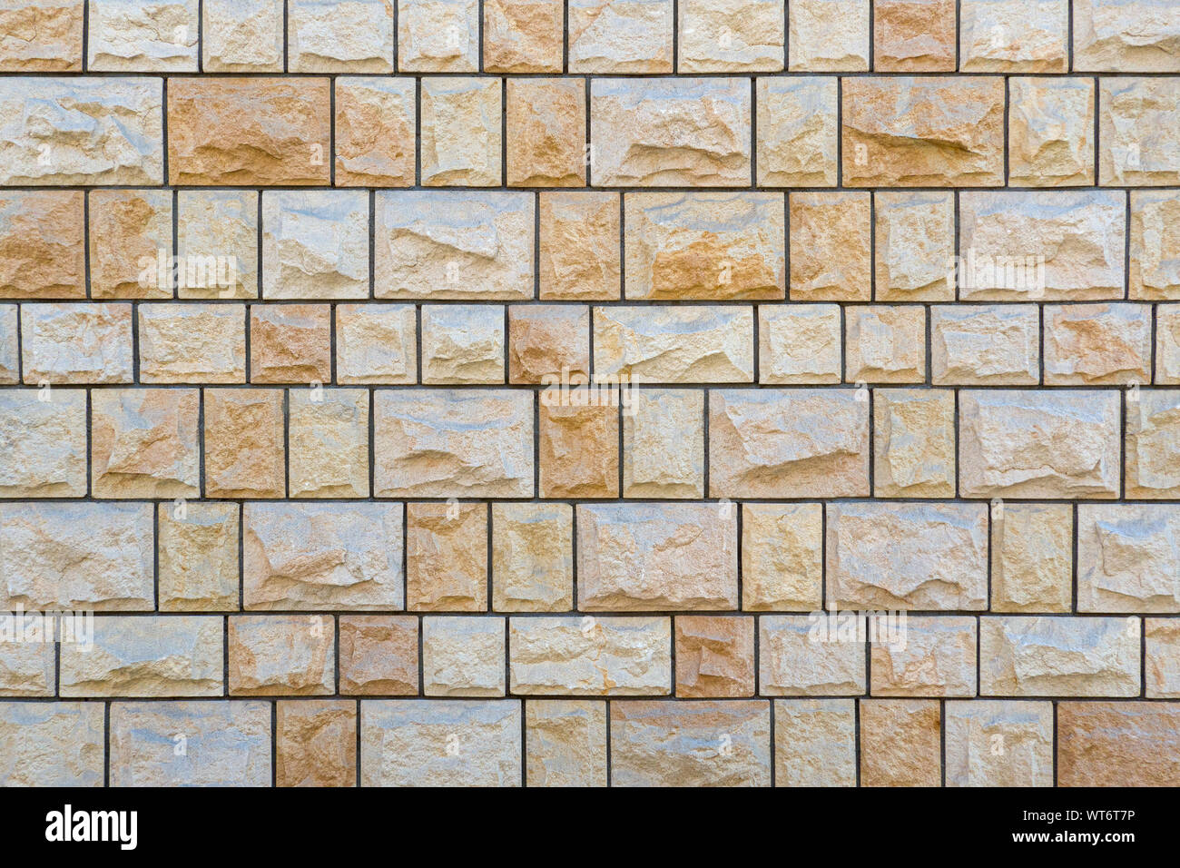 Helle stein Wand genau quadratische rauhe Natursteine Stockfoto