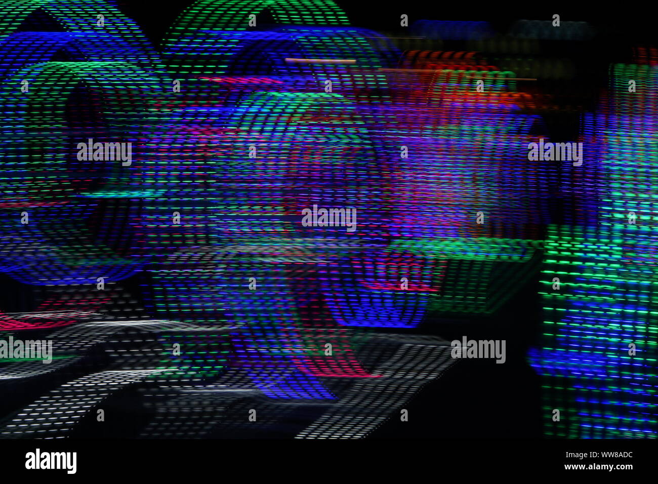 Zusammenfassung Hintergrund des unscharfen bunt gepunkteten Linien auf dunklem Hintergrund. Stockfoto