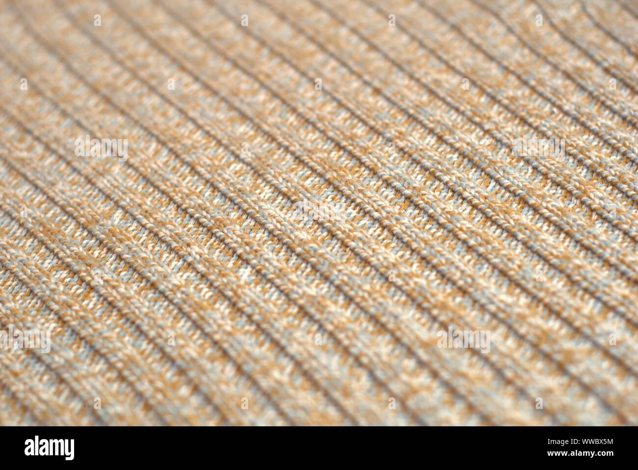 Meliert beige gestrickten Wollpullover. Textur Detail Nahaufnahme. Stockfoto