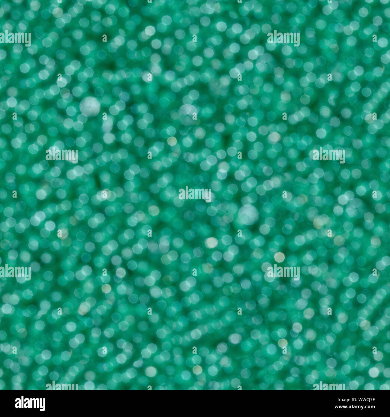 Abstrakte grünes Licht bokeh Hintergrund. Nahtlose square Textur. Stockfoto