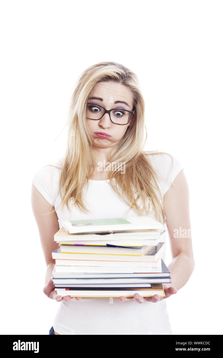 Junge Frau mit Büchern auf dem Arm vor einem weißen Hintergrund isoliert Stockfoto