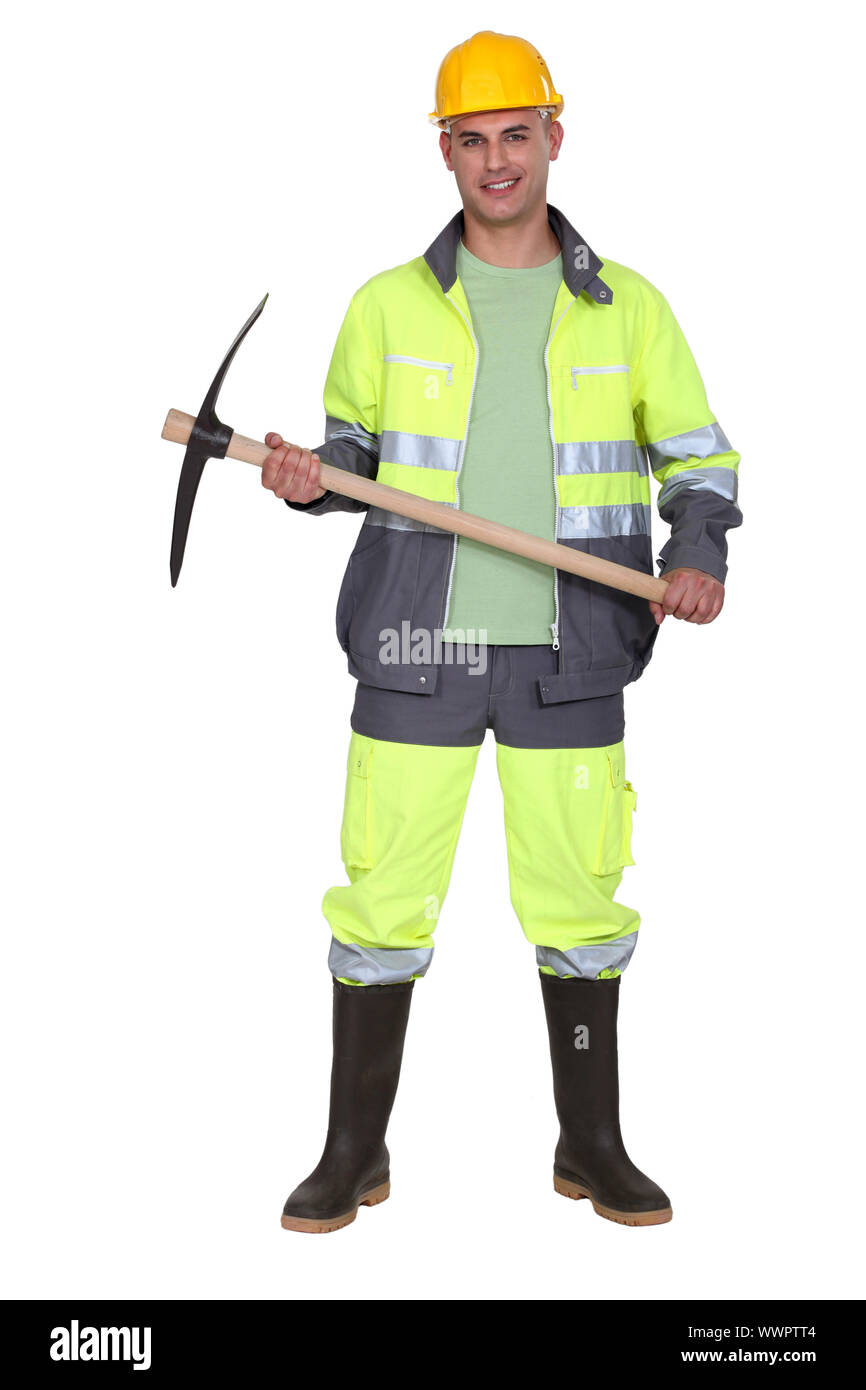 Arbeiter halten Spitzhacke Stockfoto Arbeiter halten Spitzhacke Stockfoto