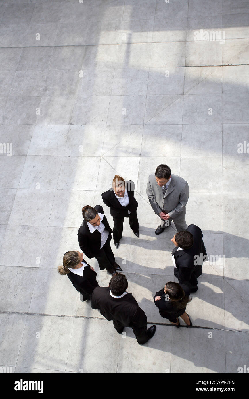 Business-Team standen in einem Kreis Stockfoto