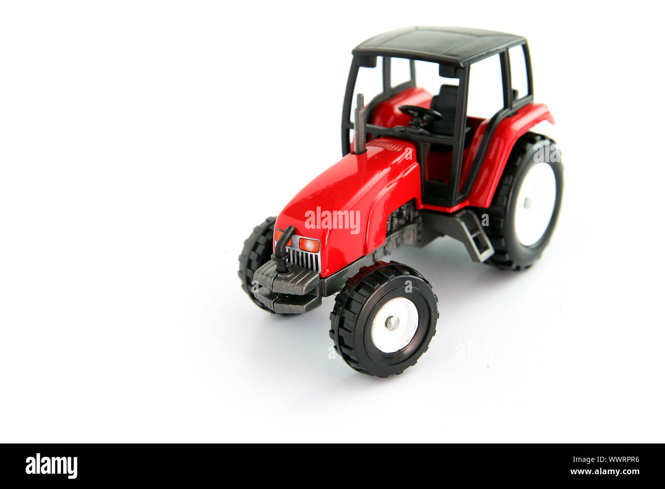 Roter Spielzeug-Traktor Stockfoto