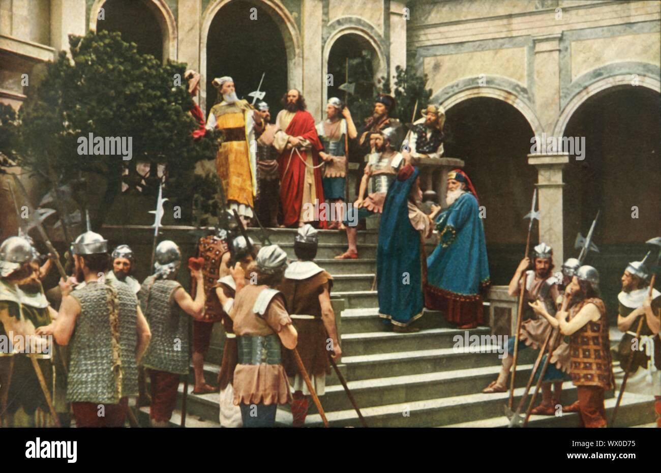 Jesus vor dem Ananias, 1922. Jesus erscheint vor dem Hohepriester Hannas (oder Ananias): Spieler in der Oberammergauer Passionsspiele. Das Spiel wird alle 10 Jahre durchgeführt, auf Open-Air-Bühnen, die von den Einwohnern des Dorfes Oberammergau in Bayern, Deutschland. Zuerst im Jahre 1634 inszeniert, das Stück erzählt die Geschichte der Passion Jesu, die ihren Höhepunkt in seiner Kreuzigung. Die Veranstaltung ist eine touristische Attraktion geworden, mit Publikum aus der ganzen Welt. Offizielle Postkarte der 1922 Oberammergauer Passionsspiele. [F. Bruckmann, München, 1922] Stockfoto