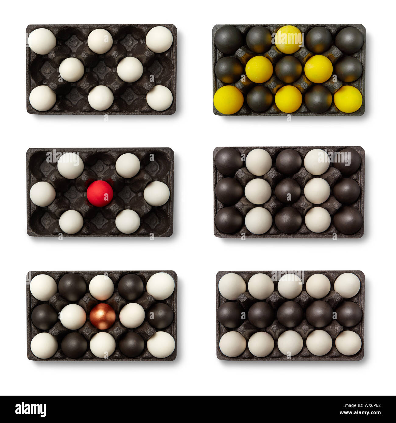 Schwarze Kartons mit unterschiedlichen farbigen Eier in Form von Tetris  Stücke auf einem weißen Hintergrund mit Kopie Raum vorgestellt  Stockfotografie - Alamy