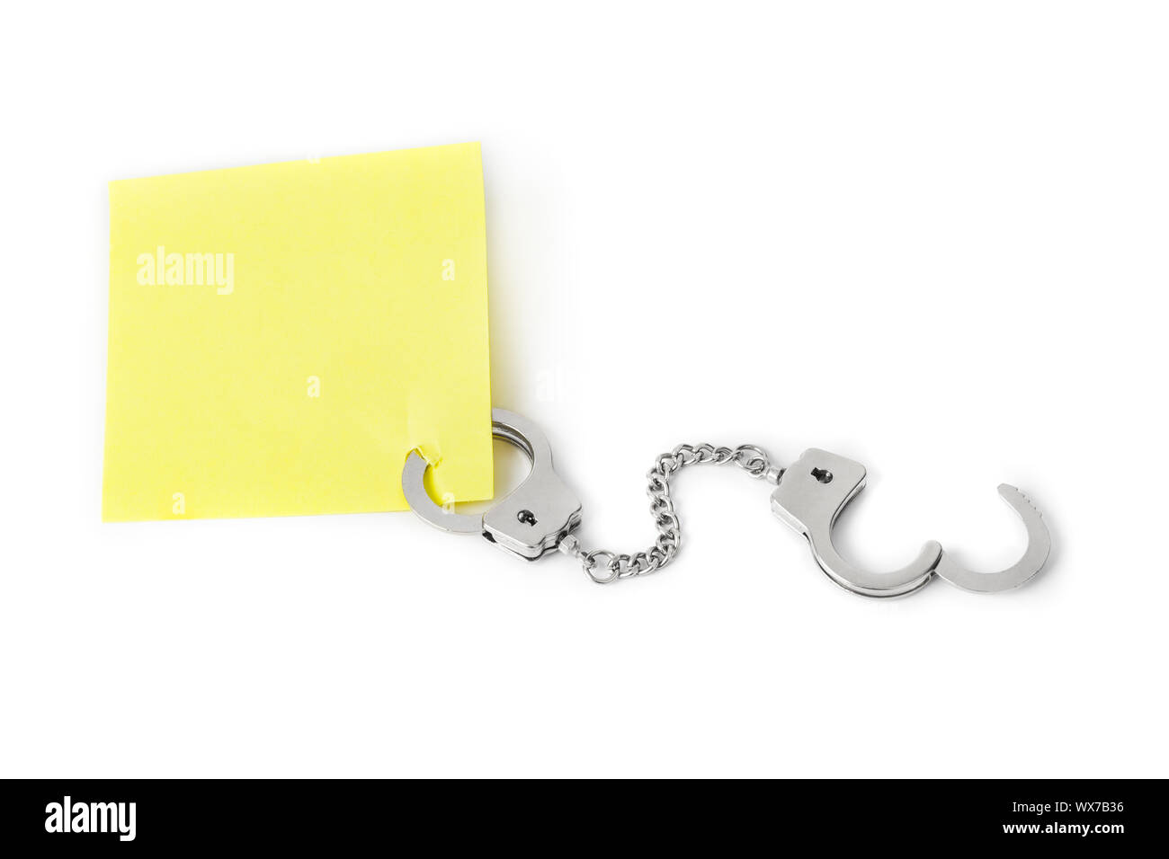 Leeres Papier mit Handschellen Stockfoto