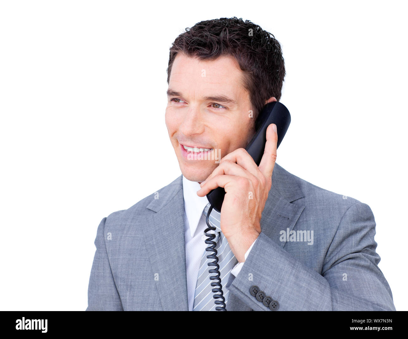 Lächelnde Geschäftsmann telefonieren vor einem weißen Hintergrund Stockfoto