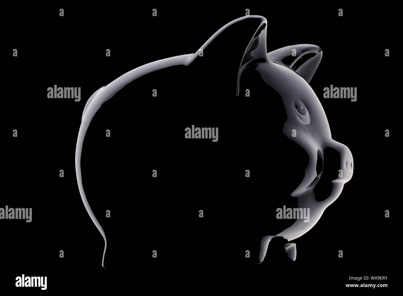 Sparschwein Silhouette über Schwarz Stockfoto