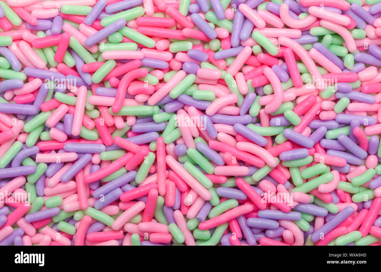Cookie und Cupcake Spinkles Nahaufnahme Hintergrund. Stockfoto