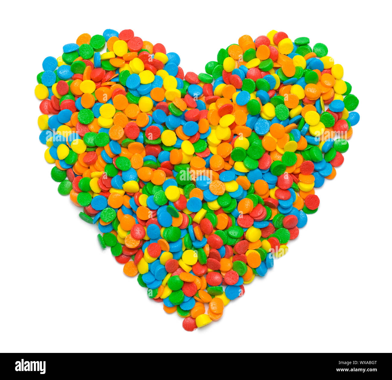 Candy Streuseln in Herz Form isoliert auf Weiss. Stockfoto