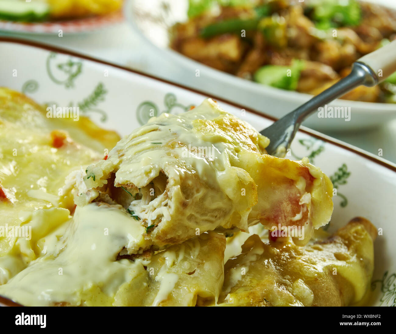 Cremige Pepperjack Chicken Enchiladas Stockfoto