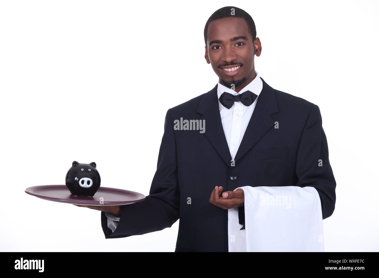 Kellner mit Sparschwein Stockfoto