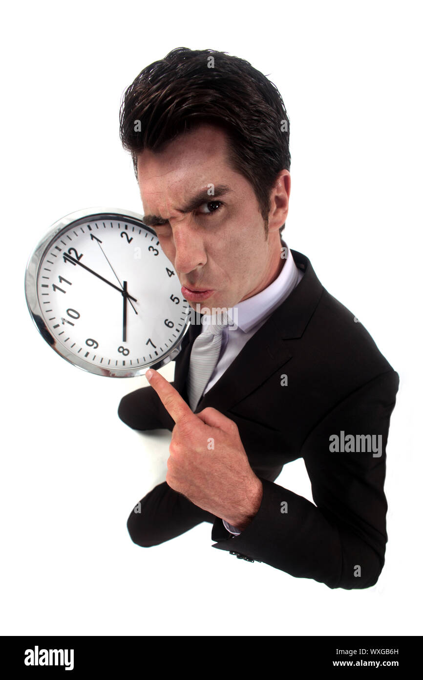 Geschäftsmann wütend auf die Uhr Stockfoto