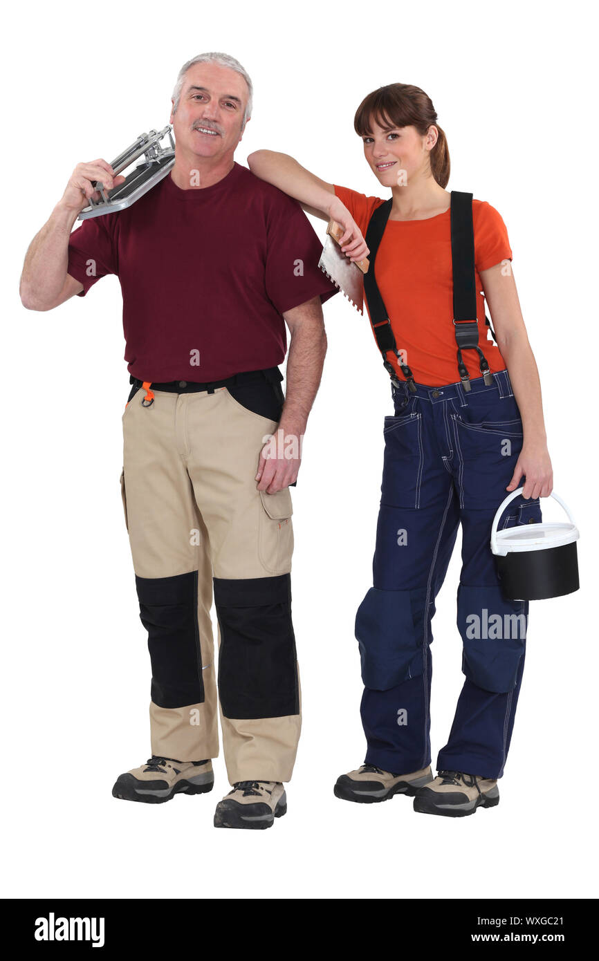 Ein Team von Fliesen-Monteure Besitz Werkzeuge Stockfoto