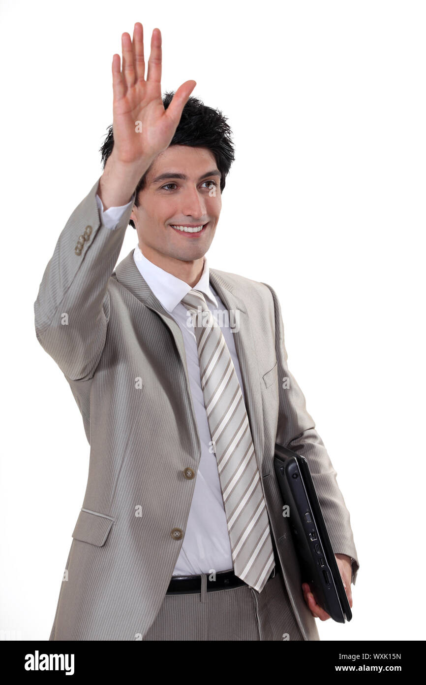 Ein Geschäftsmann winken zu empfehlen. Stockfoto