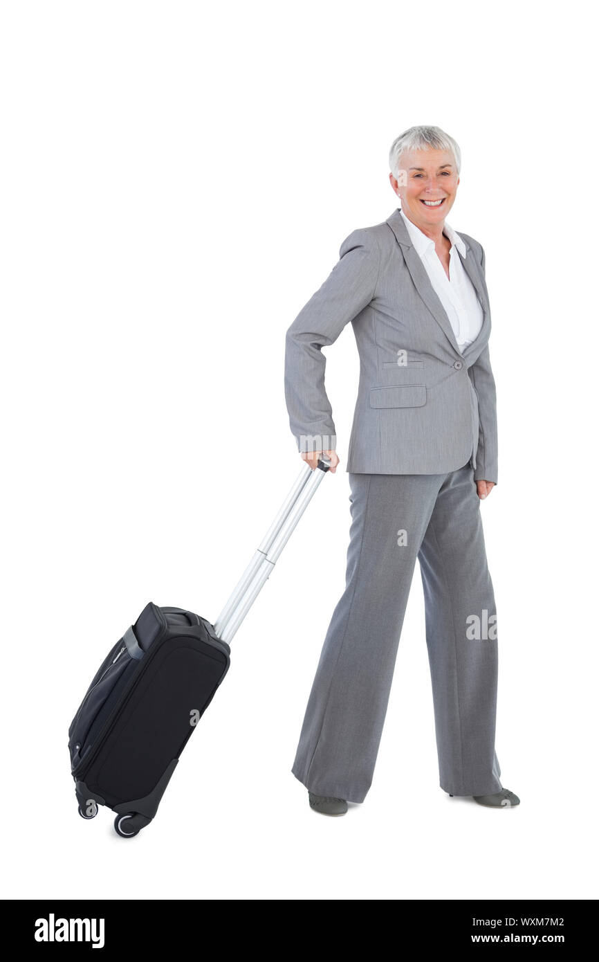 Smilling Geschäftsfrau mit ihrem Gepäck auf weißem Hintergrund Stockfoto