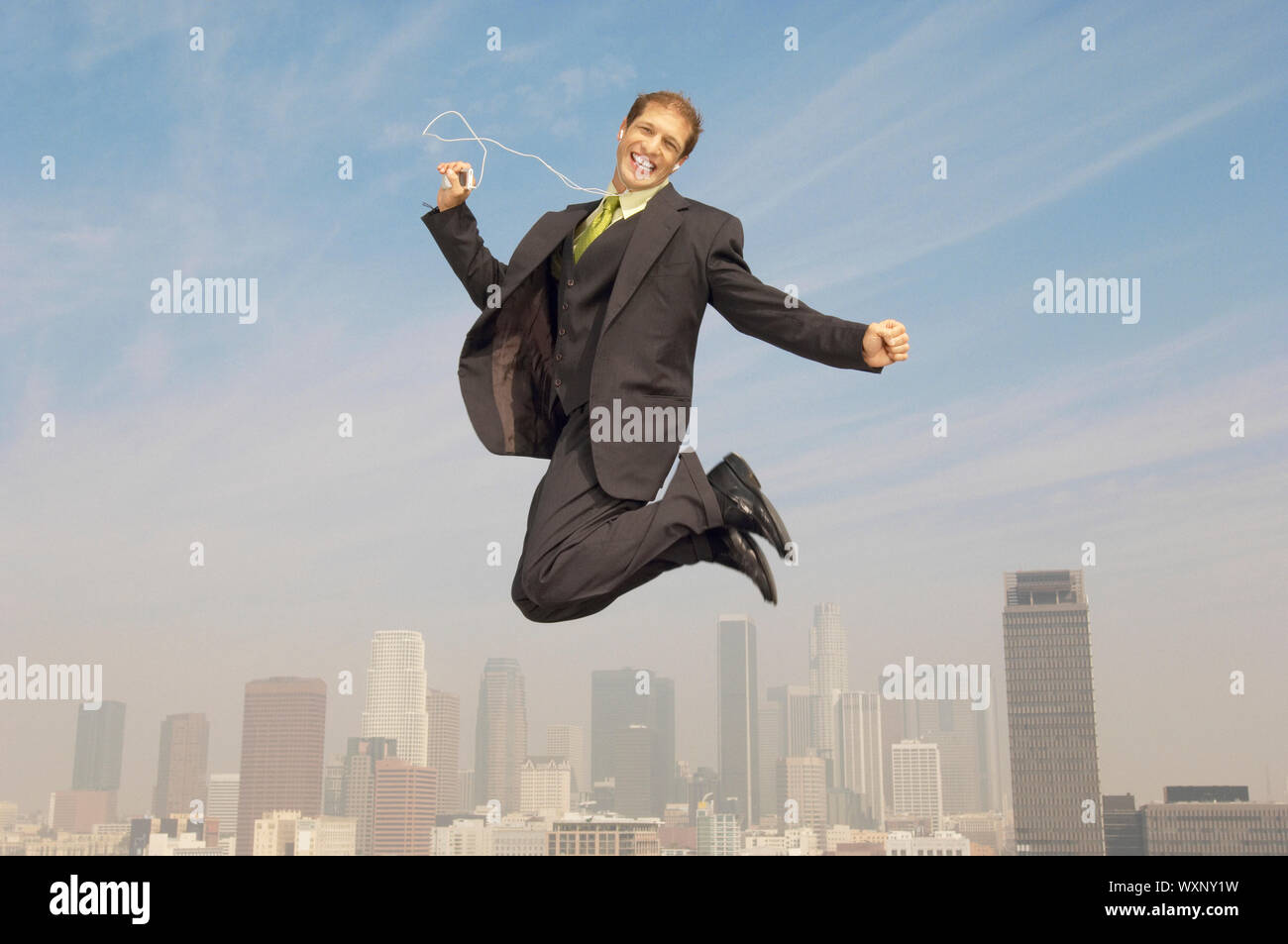 Geschäftsmann mit MP3-Player Stockfoto