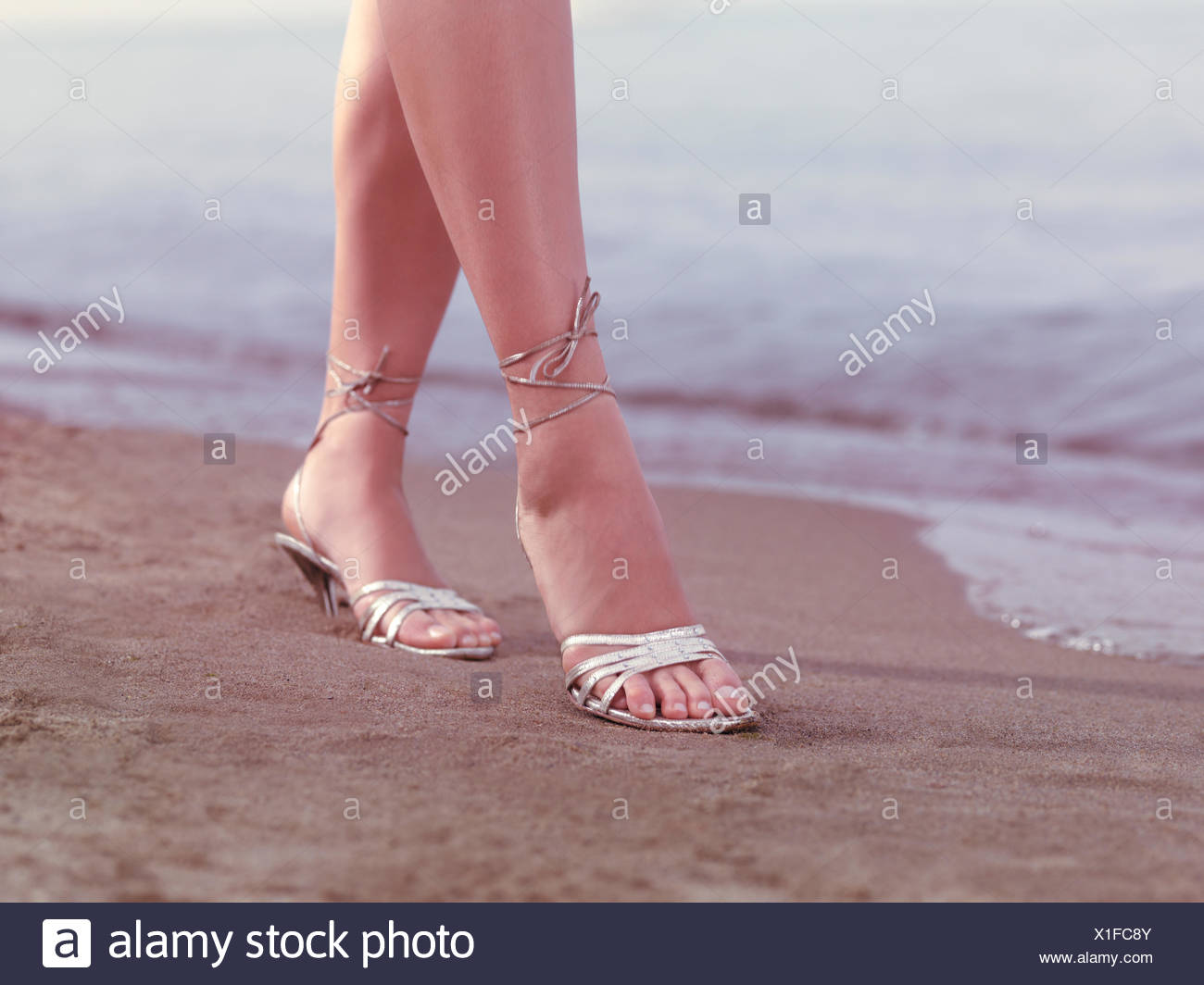 Woman High Heels On Beach Stockfotos & Woman High Heels On Beach Bilder