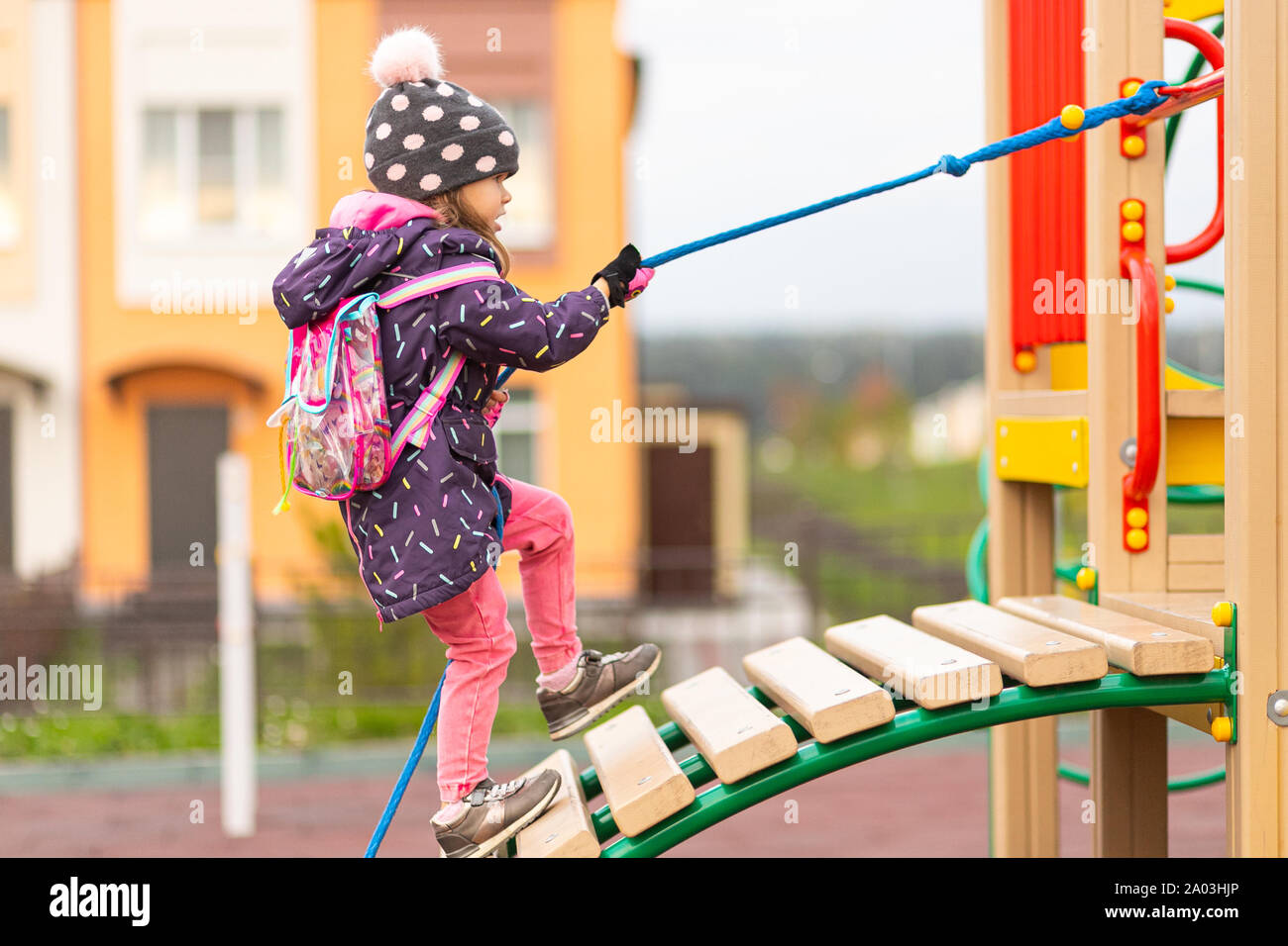 Young girl climbs ladder success fotografías e imágenes de alta resolución  - Alamy