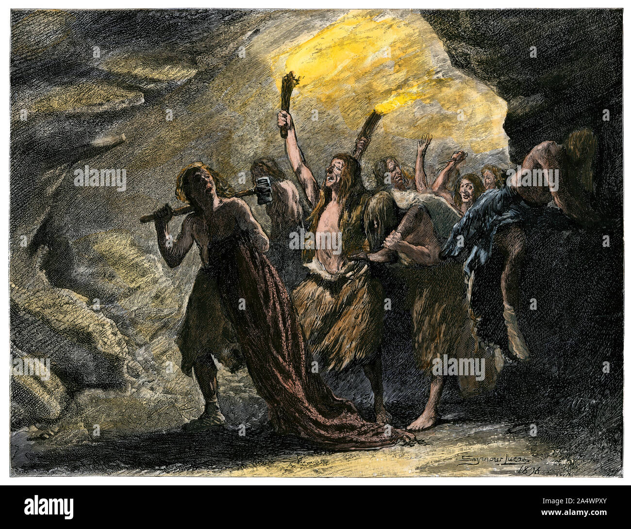 Los seres humanos de la Edad de Piedra llevando antorchas en una cueva. Xilografía coloreada a mano Foto de stock