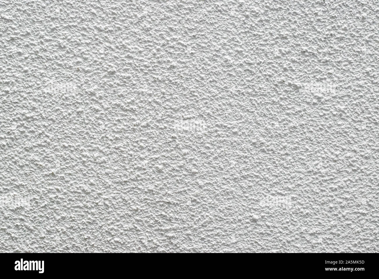 Textura de estuco blanco de un techo de pared seca, textura de pared de piedra Foto de stock