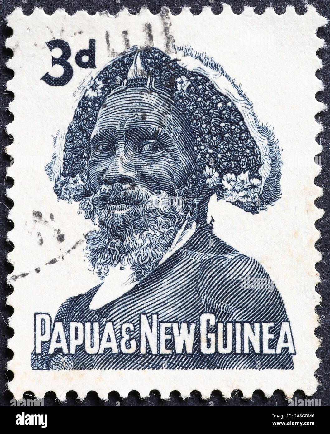 El hombre nativo de Papua Nueva Guinea el viejo sello Foto de stock