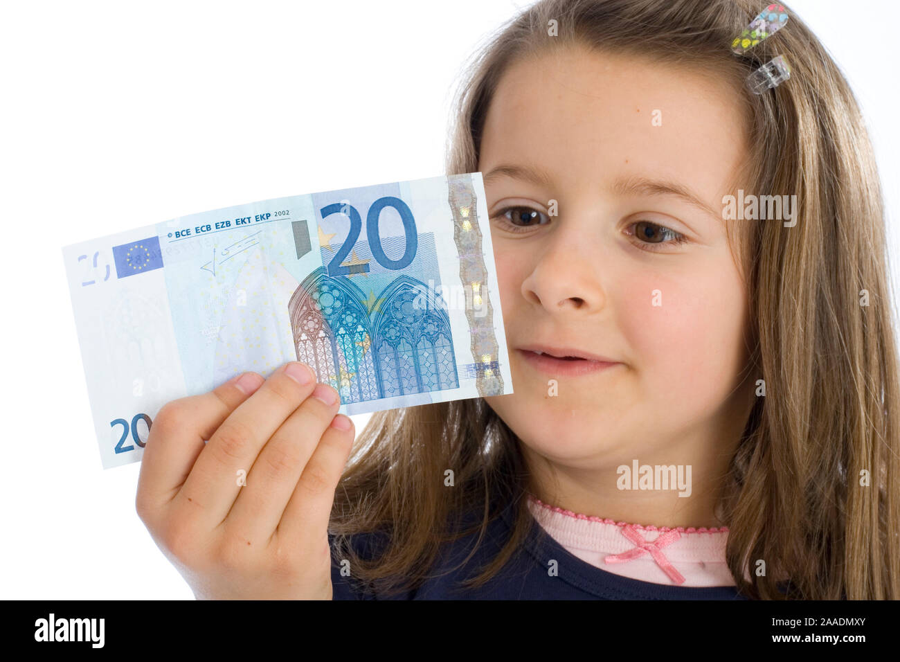 Sechsjähriges Mädchen mit Geldschein (MR) Foto de stock