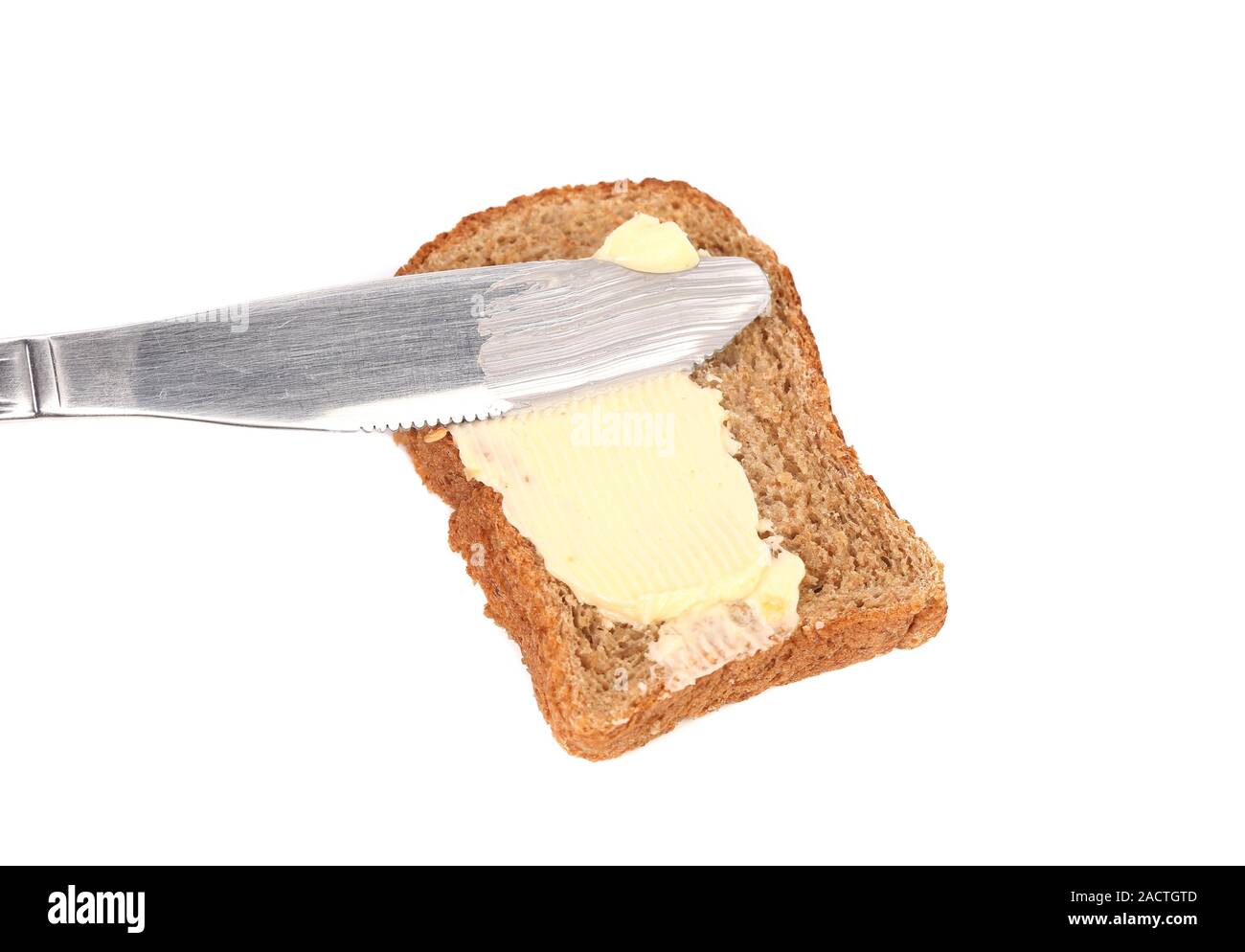 Untar mantequilla en el pan de la cuchilla Fotografía de stock - Alamy