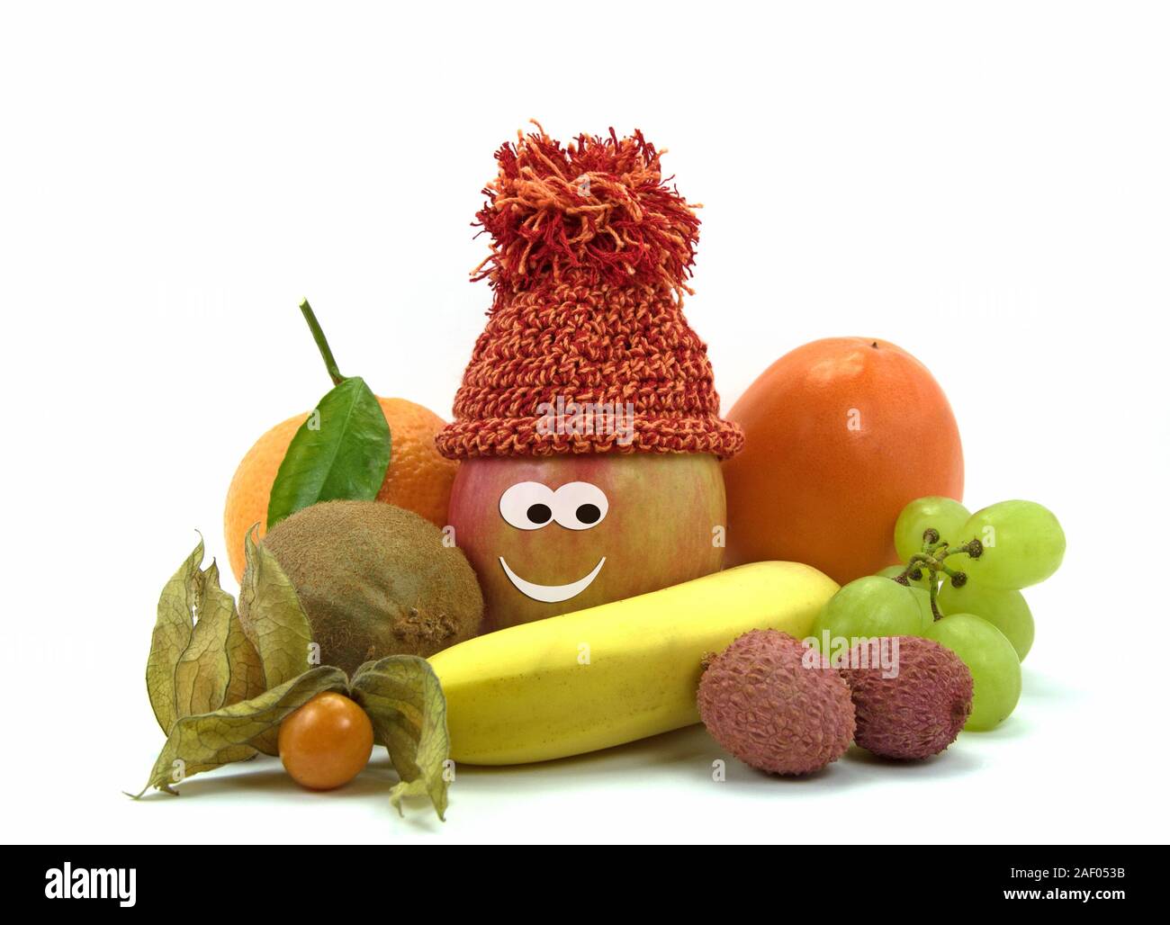 Frutos sanos con la cara delante de un fondo blanco Foto de stock