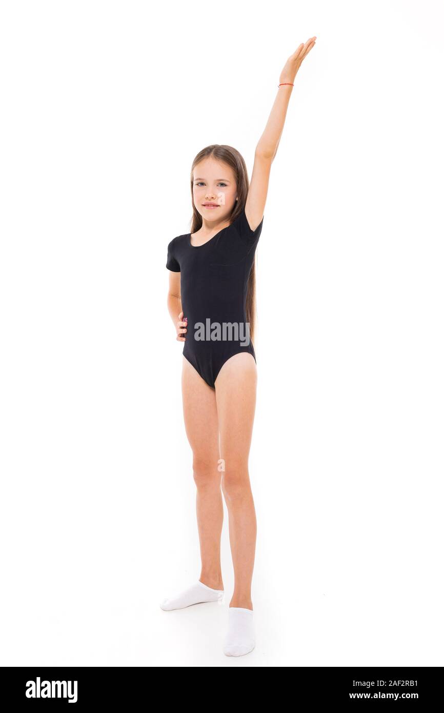 Hermosa niña gimnasta en leotardos hacer algunos ejercicios fondo blanco Fotografía stock - Alamy