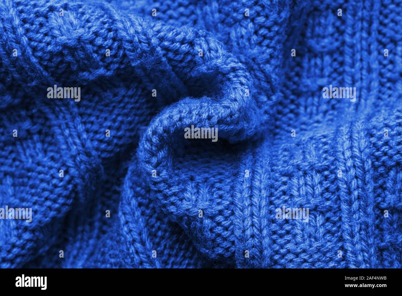 Suéter de tejido trenzado de fondo en forma de espiral. Patrón de color azul  marino. La superficie facial. Espacio de copia Fotografía de stock - Alamy