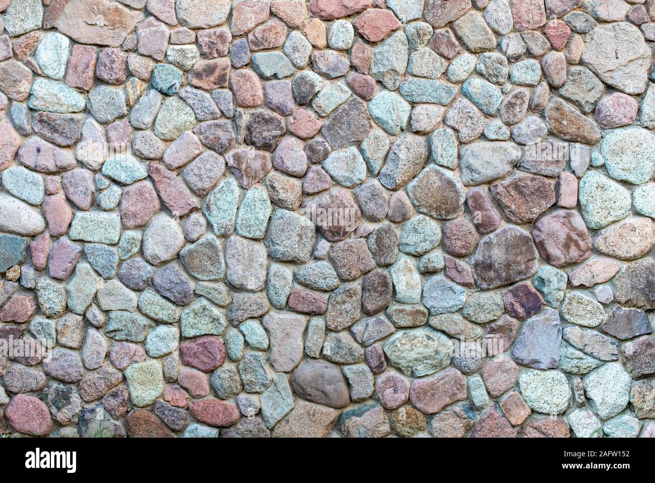 La Textura De La Pared De Piedra Patron De Diseno Real Decorativos En La Superficie De Una Pared De Piedra Con Cemento Contexto Natural De Pared De Roca Fotografia De Stock