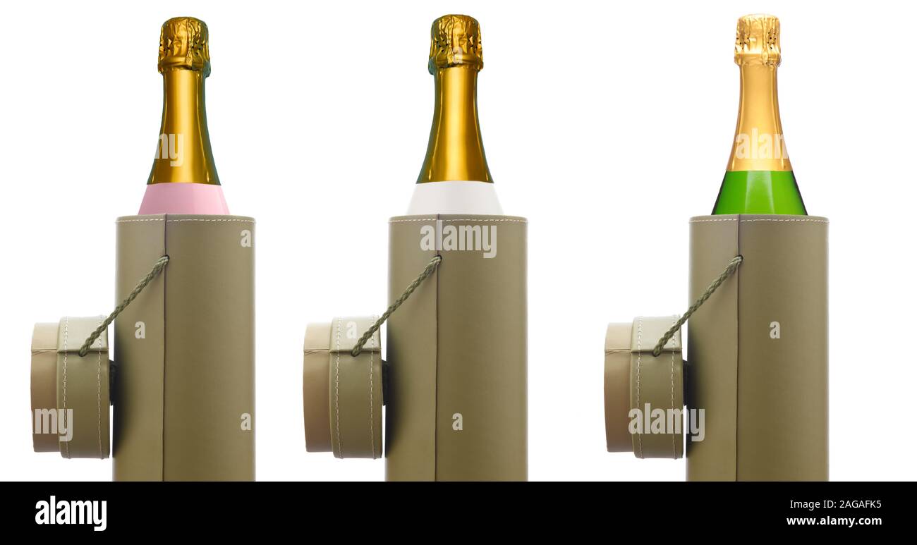 Champagne: tres tipos diferentes de botellas de vino espumoso en una caja de regalo redondo, aislado en blanco. Rosa, blanco y verde de botellas. Foto de stock