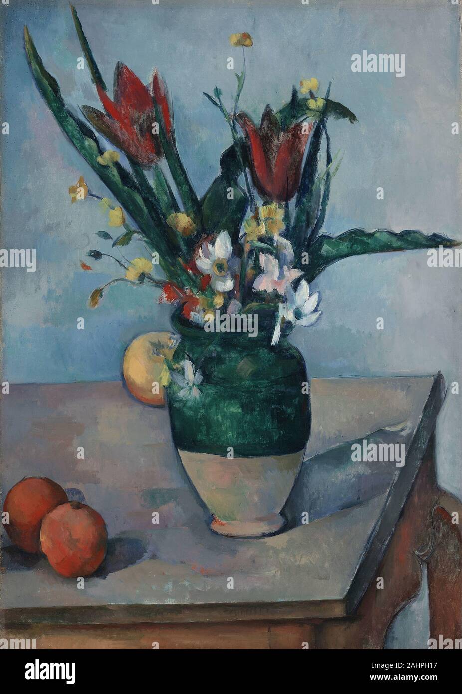 Paul Cézanne. El jarrón de tulipanes. 1885-1895. Francia. Óleo sobre lienzo  la tabla en este bodegón de flores y frutas aparece en varios de otras  pinturas de Paul Cézanne, aunque los especialistas