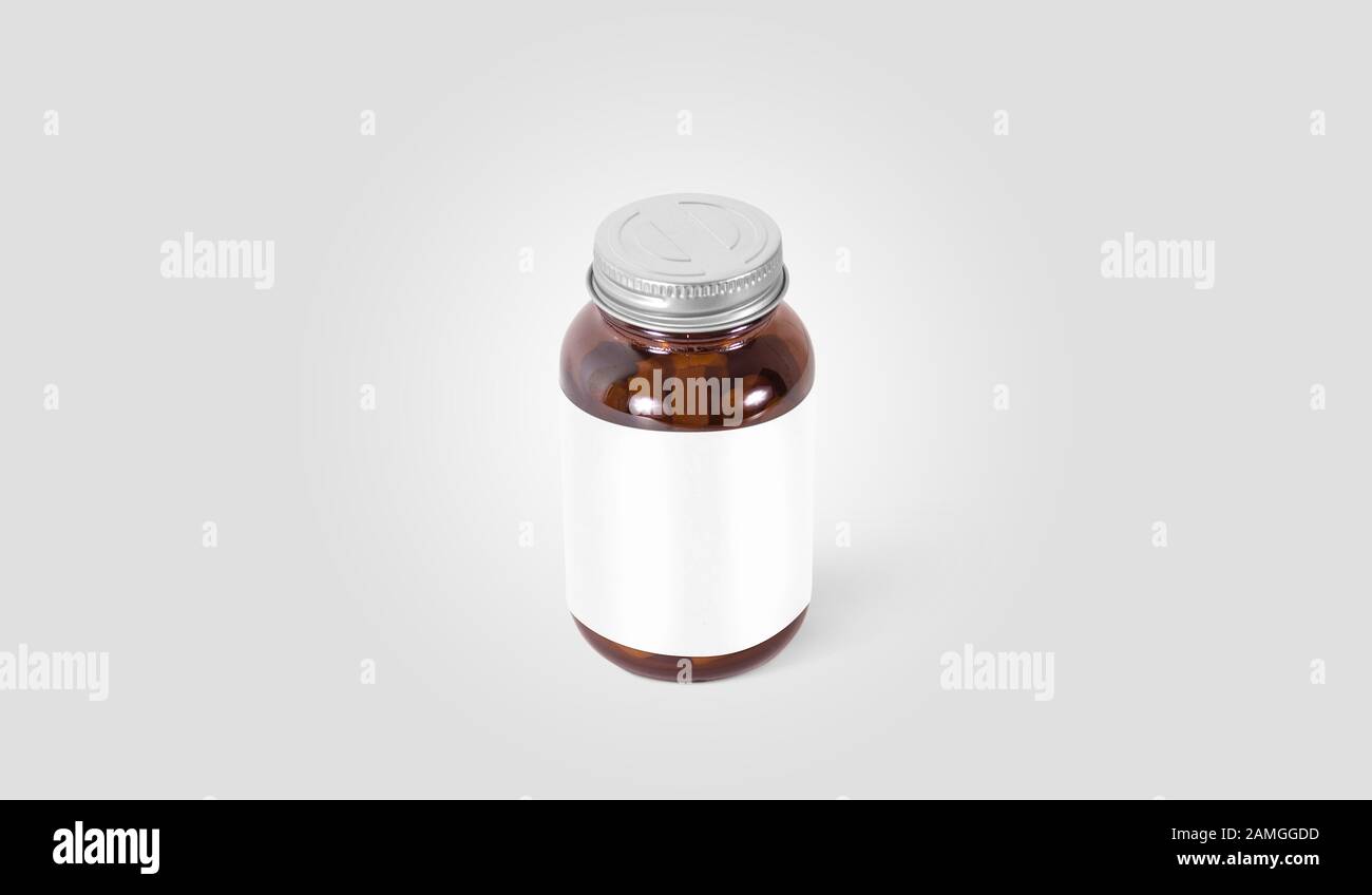 La píldora de vidrio ámbar en blanco puede con la etiqueta blanca se burla Foto de stock
