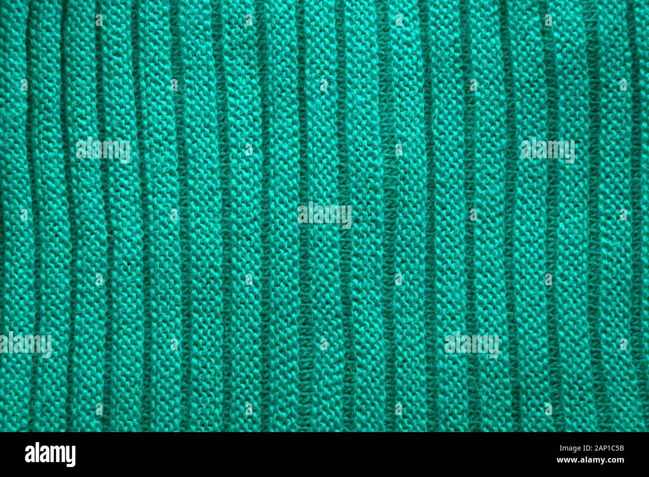 Tejidos en verde. Tejido de fondo. Tejidos de textura. Patrón de tejido de lana. Foto de stock