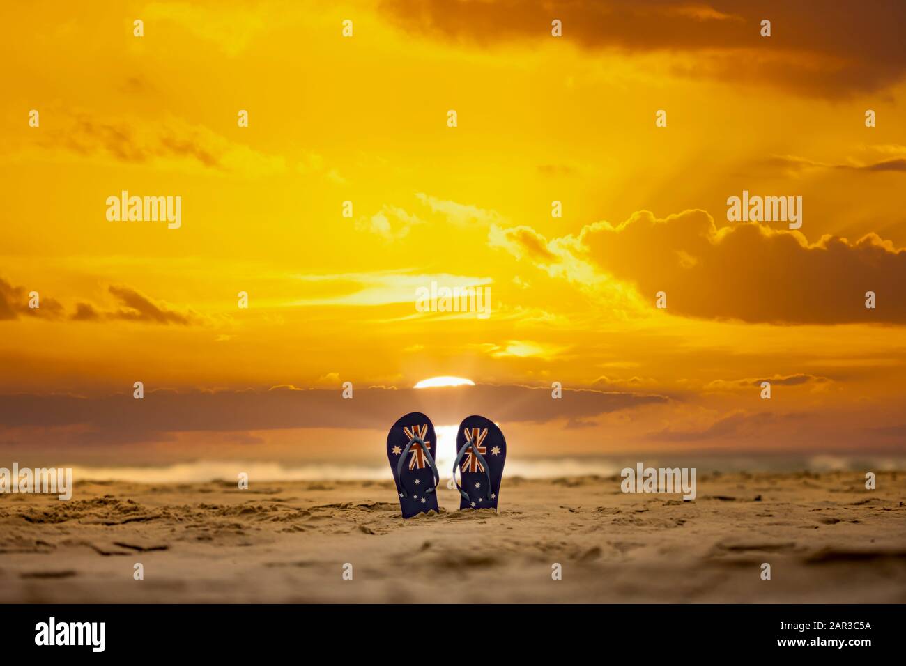 Tangas australiano que se pegan en arena con un espectacular fondo del amanecer. Concepto de día de Australia Foto de stock