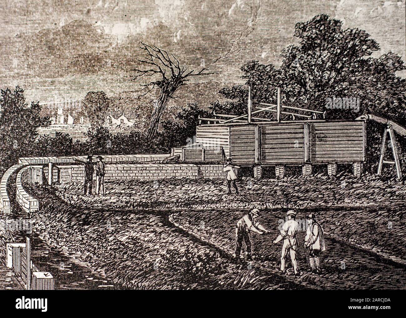 Grabado del siglo XIX que muestra el tanque en la granja de aguas residuales cerca de Barking, Reino Unido, donde las aguas residuales domésticas se utilizan para fertilizar la tierra agrícola Foto de stock