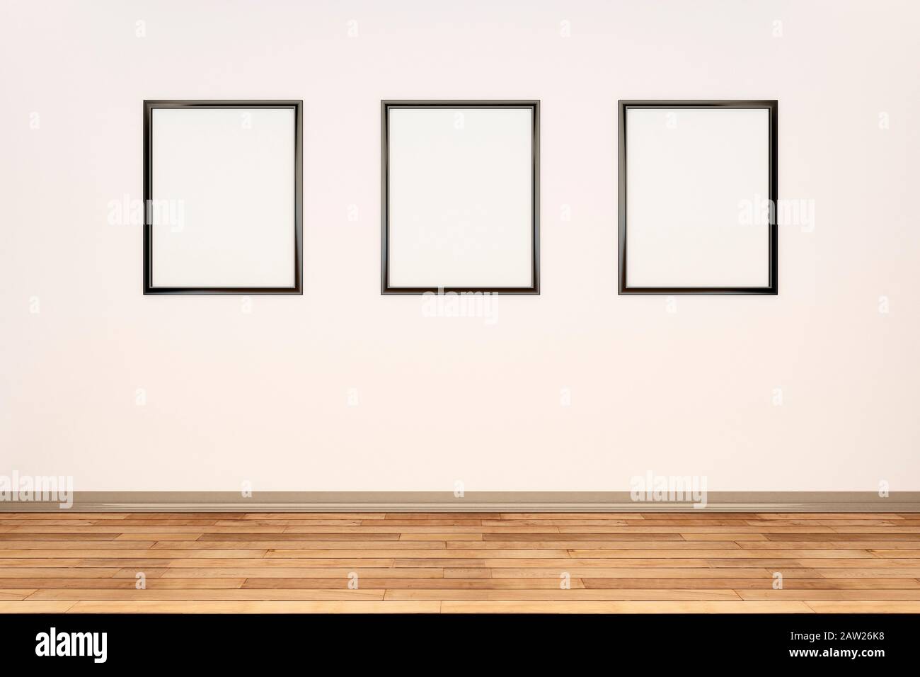 Tres marcos de fotos en blanco en una fila en una pared de color crema en una habitación grande Foto de stock