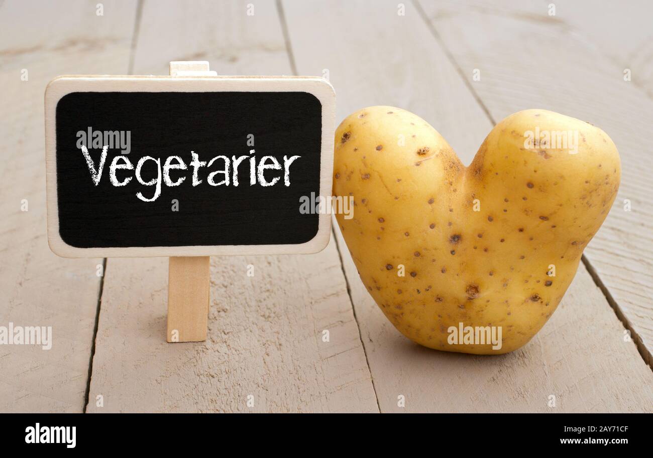 Escudo vegetariano con patata del corazón Foto de stock