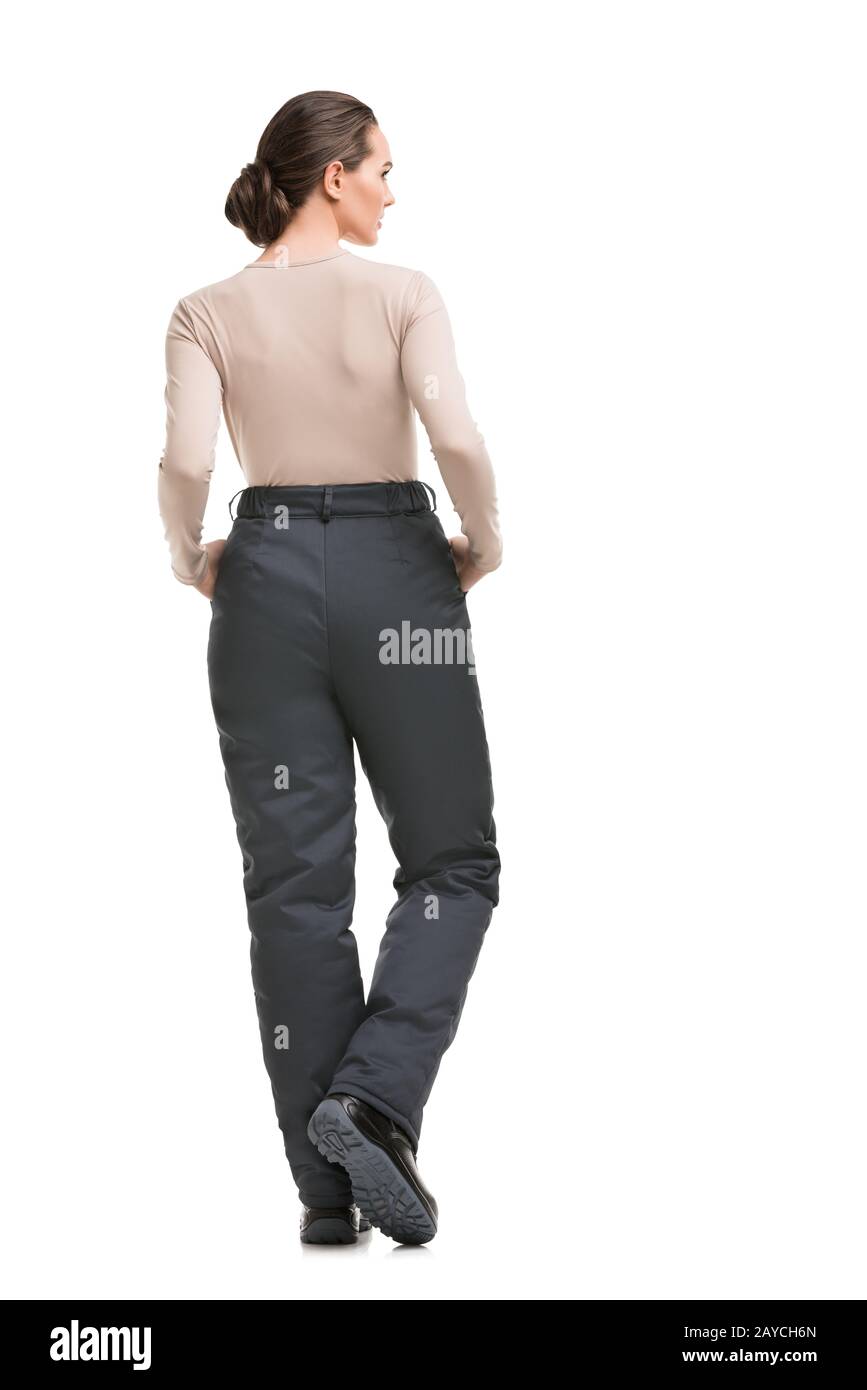 Mujer en pantalones de trabajo gris aislada vista trasera Fotografía de  stock - Alamy