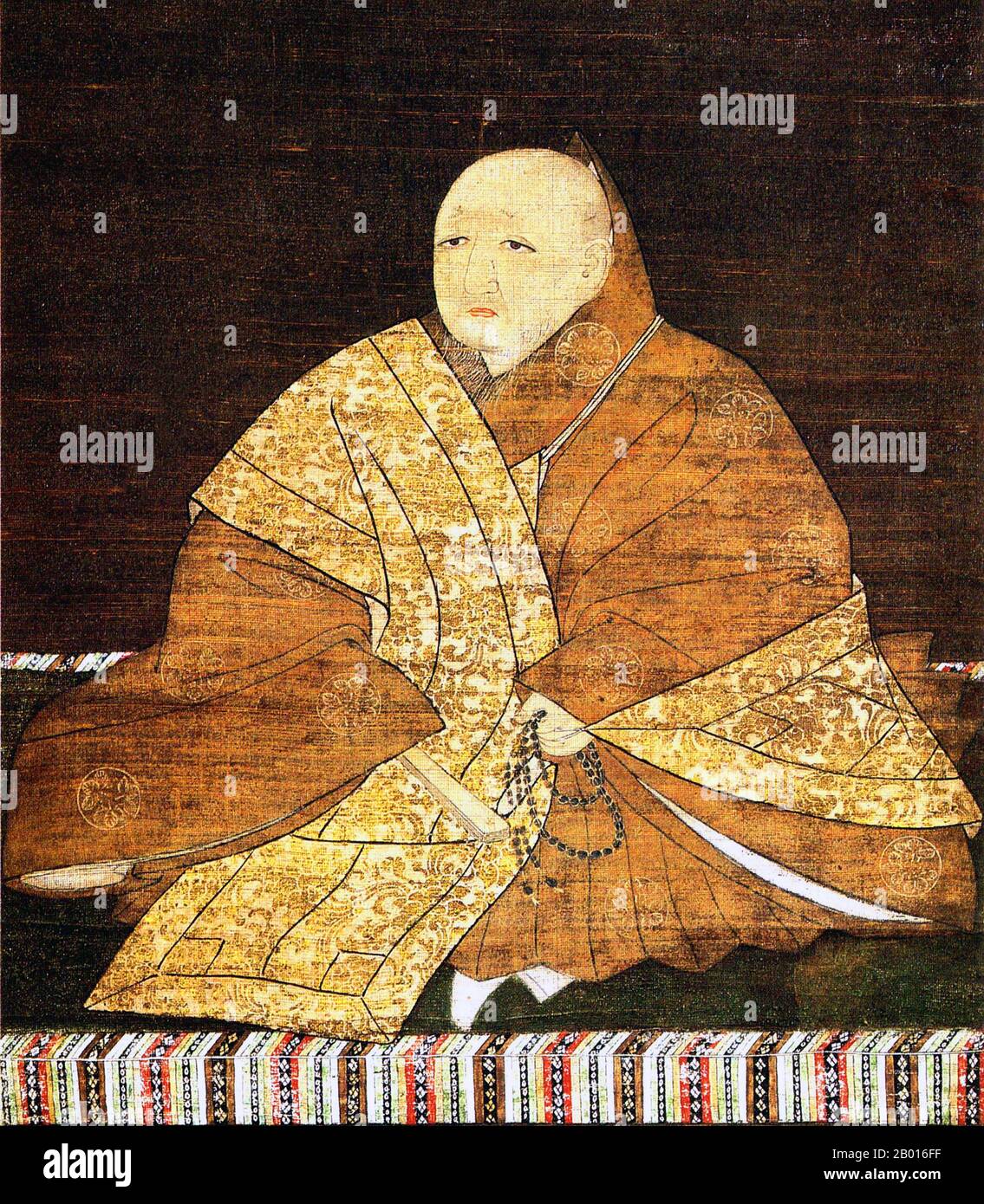 Japón: Yoshimitsu Ashikaga (25 de septiembre de 1358 - 31 de mayo de 1408), 3rd gobernante del Shogunato de Ashikaga (r. 1368-1394). Colgante de rollo de pintura, siglo 15th. Ashikaga Yoshimitsu, nacido Haruo, fue el shogun de 3rd del shogunato de Ashikaga, y el tercer hijo del segundo shogun Ashikaga Yoshiakira. Se convirtió en shogun a la edad de diez años. Fue la primera persona de la clase samurai en albergar a un emperador reinante en su propiedad privada en 1381. En 1392, terminó con el cisma imperial Nanboku-cho que había plagado la política durante más de medio siglo, y se retiró del cargo público en 1395 para convertirse en monje. Foto de stock