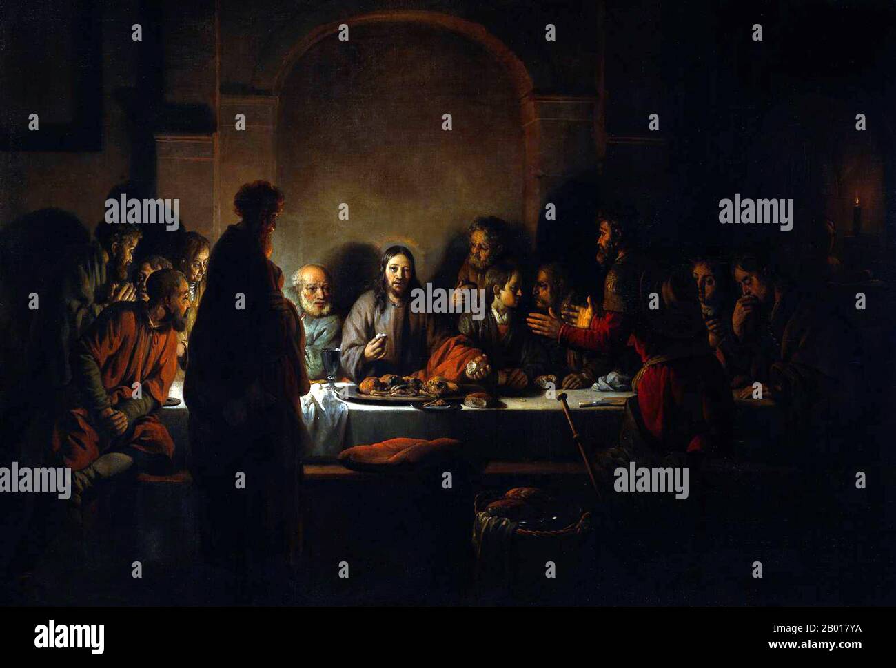 Países Bajos: 'La última cena'. Óleo sobre lienzo de Gerbrand van den Eeckhout (19 de agosto de 1621 - 29 de septiembre de 1674), 1664. Van den Eeckhout era un estudiante de Rembrandt y, como su mentor, prefería usar colores oscuros y contrastes con la luz. En esta obra maestra, muestra a Jesucristo en el centro, iluminado por la luz de las velas y un halo. Jesús rompe el pan para compartir con sus discípulos que parecen estar ansiosos y profundamente en discusión. Ellos son engañados porque Cristo acaba de declarar que uno de ellos lo traicionaría. Jesús parece estar mirando a Judas, quien está de pie en primer plano. Foto de stock