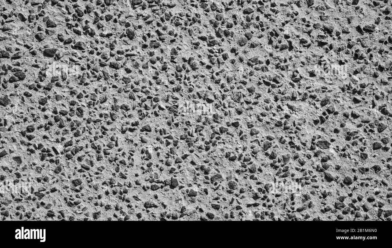 Imagen de fondo con una pequeña piedra de granito y arena de un camino  Fotografía de stock - Alamy